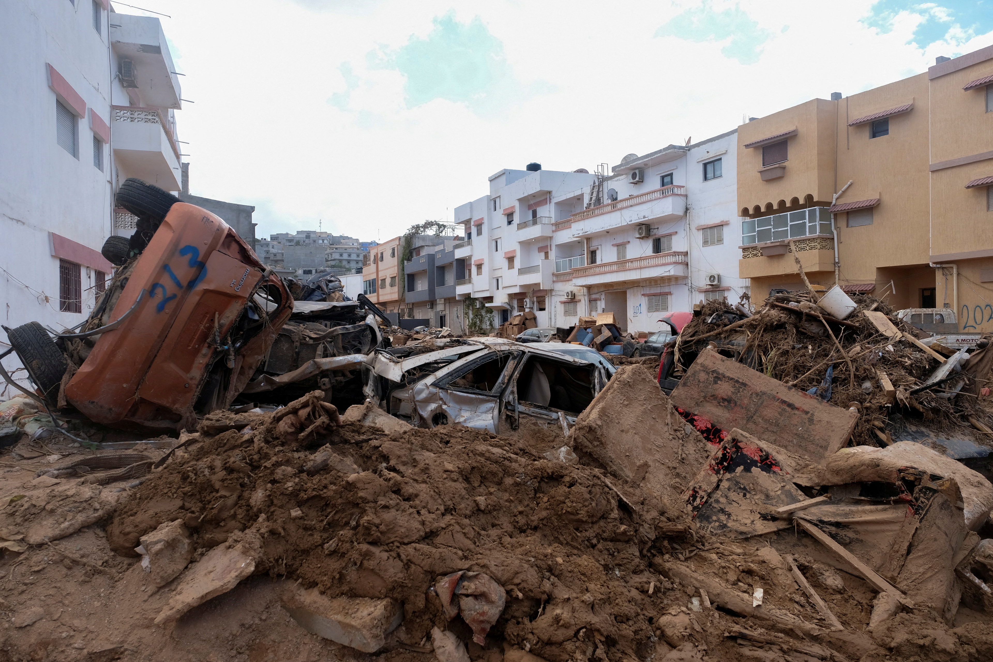 FILE PHOTO: A view shows damaged cars that were impacted by fatal floods in Derna, Libya, September 28, 2023. REUTERS/Esam Omran Al-Fetori