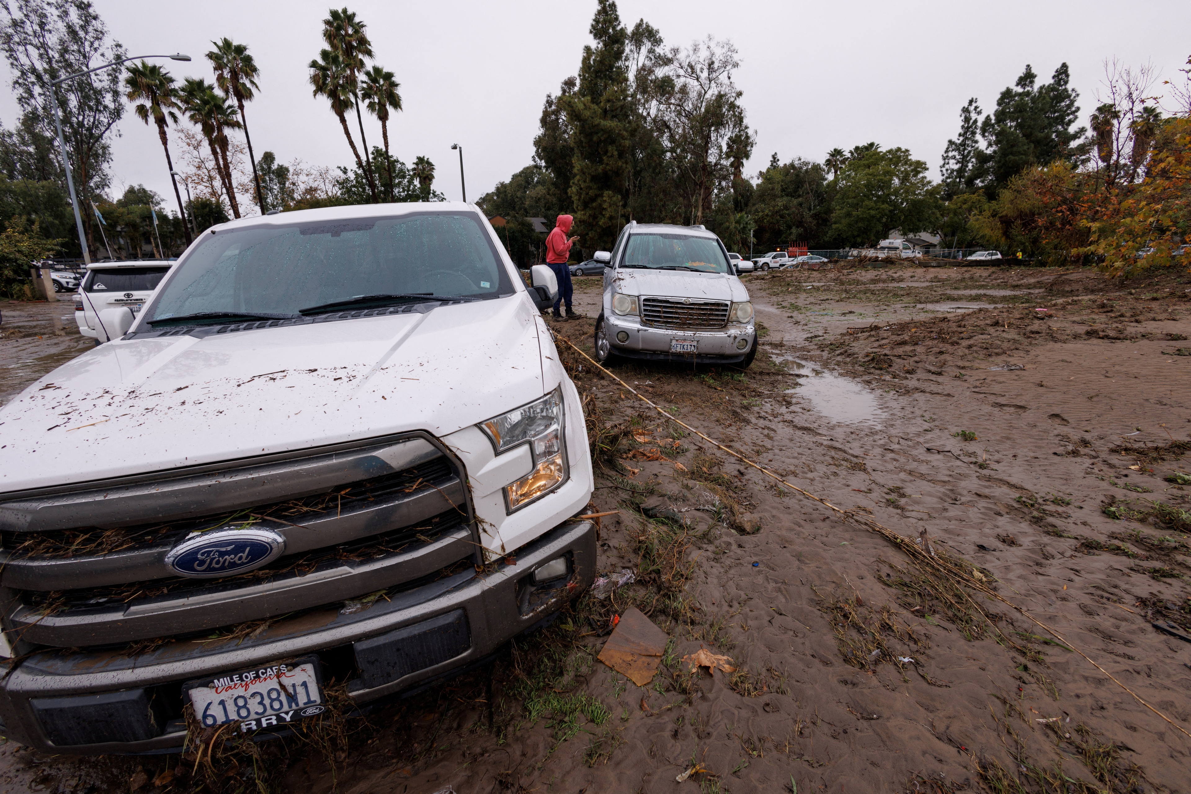 FILE PHOTO: Damage is shown after a heavy rain storm causes a small river to overflow into a neighborhood in San Diego, California, U.S. January 22, 2024.  REUTERS/Mike Blake