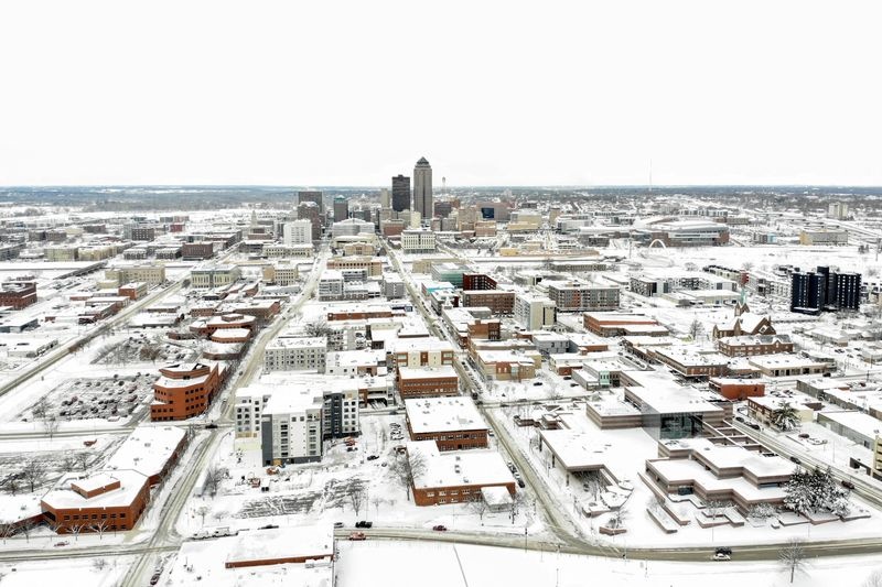 An aerial view of downtown covered in snow, ahead of Iowa state caucus vote, in Des Moines, Iowa, U.S. January 15, 2024. REUTERS/Marco Bello