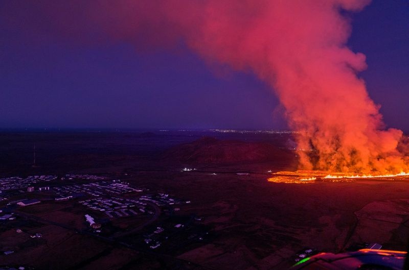 Lava flows from a volcano in Grindavik, Iceland, January 14, 2024. Icelandic Coast Guard/Handout via REUTERS