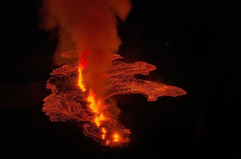 Lava flows from a volcano in Grindavik, Iceland, January 14, 2024. Icelandic Coast Guard/Handout via REUTERS