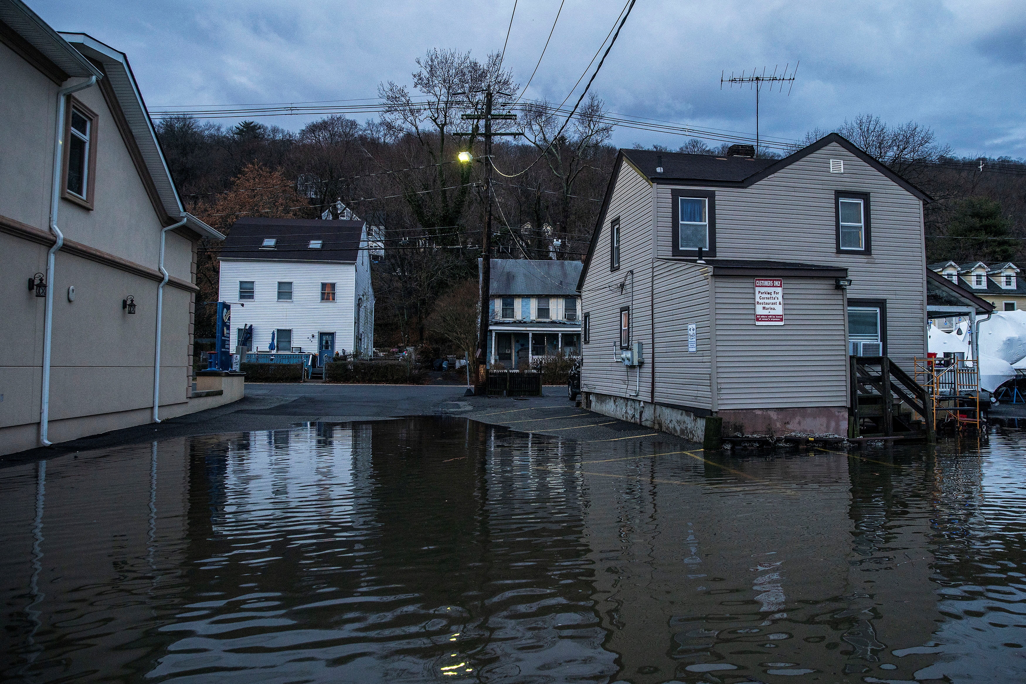 Water rises at a residential area in an aftermath of a storm in Piermont, New York, U.S., January 10, 2024. REUTERS/Eduardo Munoz/ File Photo