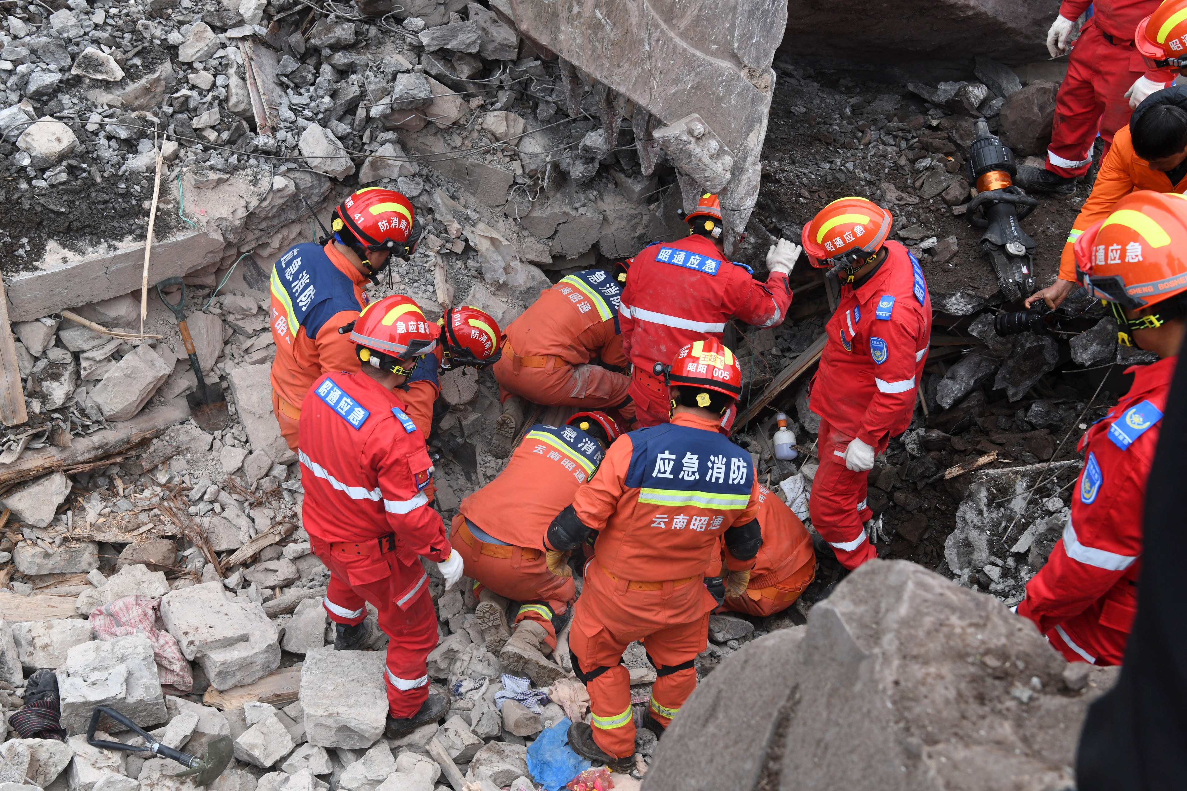 Rescue workers search for survivors in the debris after a landslide hit Zhenxiong County, in Zhaotong, Yunnan province, China January 22, 2024. China Daily via REUTERS