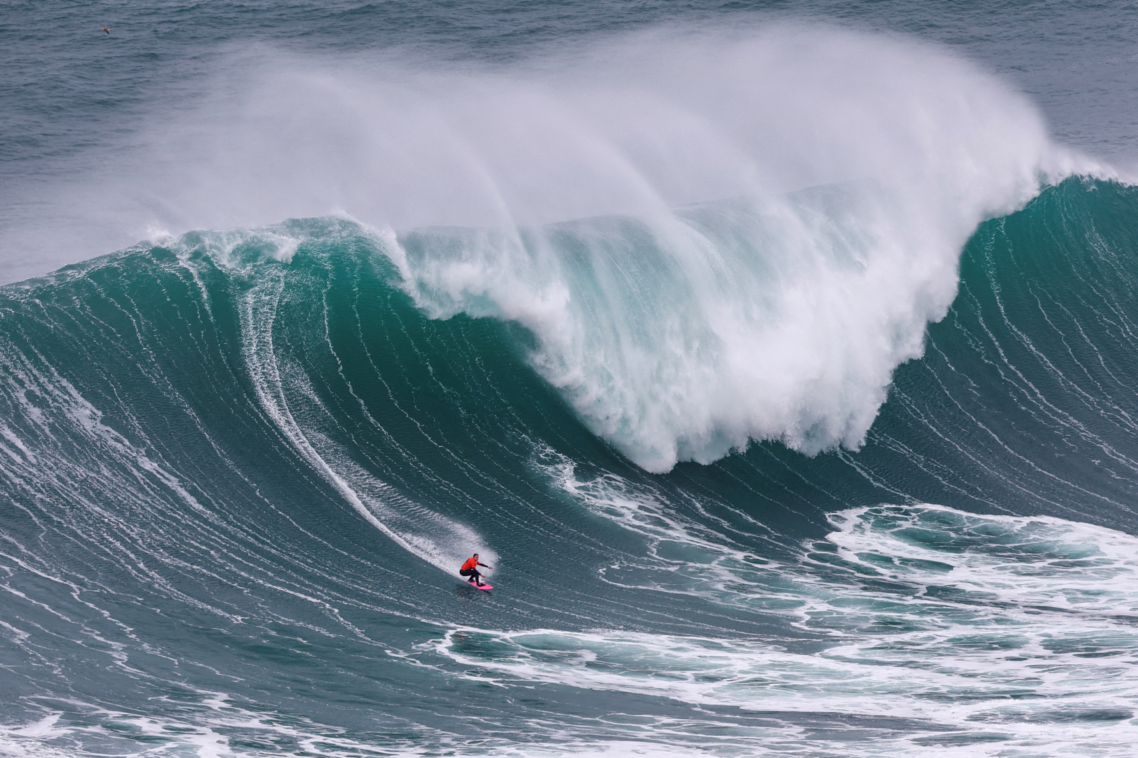 Brazilian big wave surfer Maya Gabeira rides a wave in Praia do Norte, Nazare, Portugal. January 22, 2024. REUTERS/Pedro Nunes