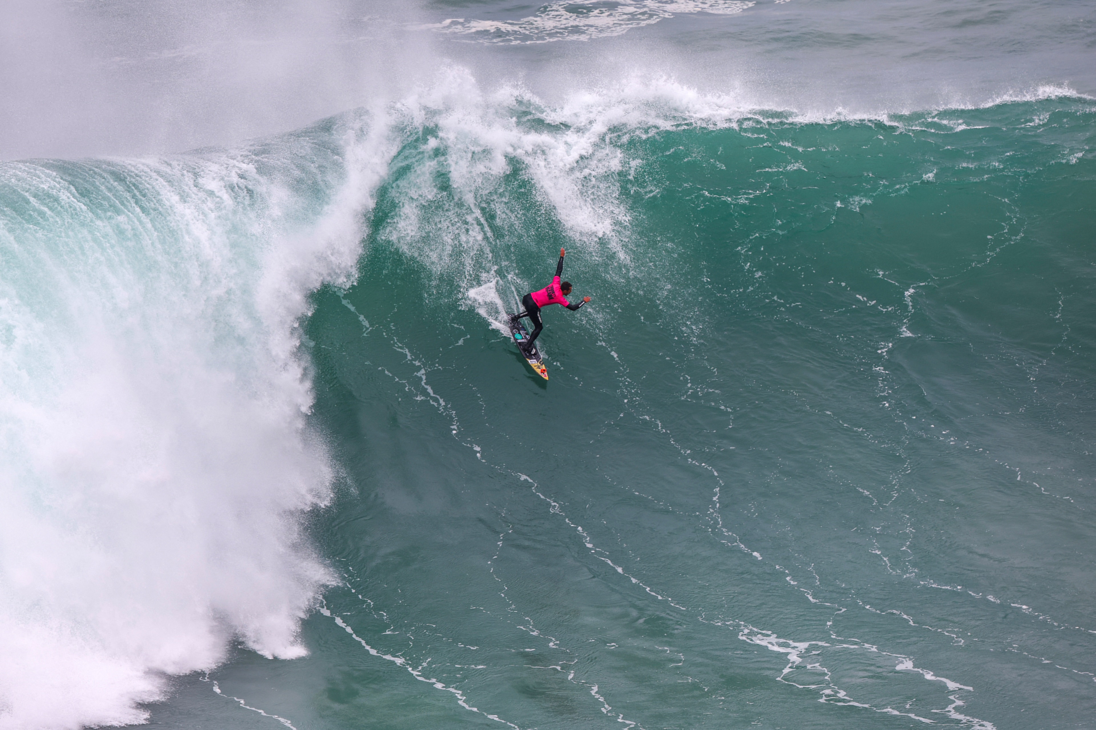 Brazilian big wave surfer Lucas Chianca rides a wave in Praia do Norte, Nazare, Portugal. January 22, 2024. REUTERS/Pedro Nunes